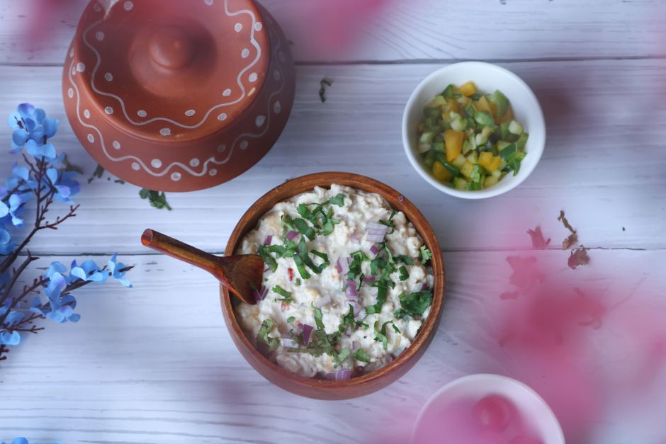 Bowl of yoghurt with cucumber and herbs