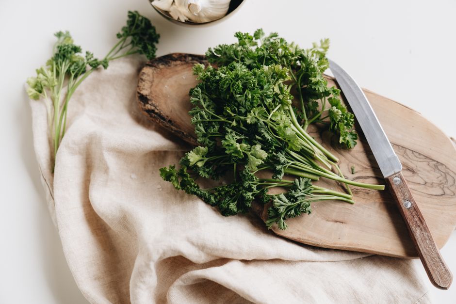 Freshly cut spring greens on a chopping board