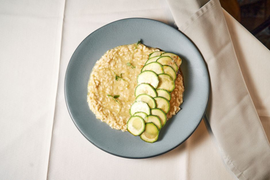 Plate of sliced courgette with a creamy dip