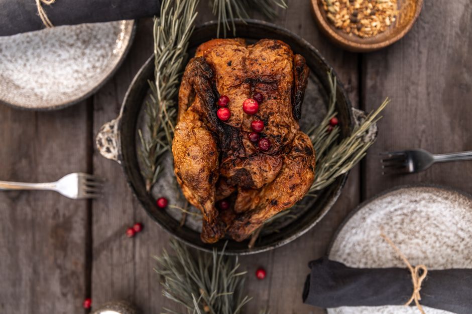 Roast joint in a cast-iron pan with rosemary