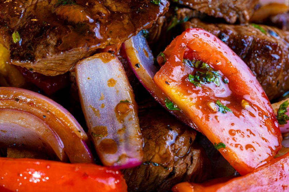 Roasted peppers and vegetables on a baking tray