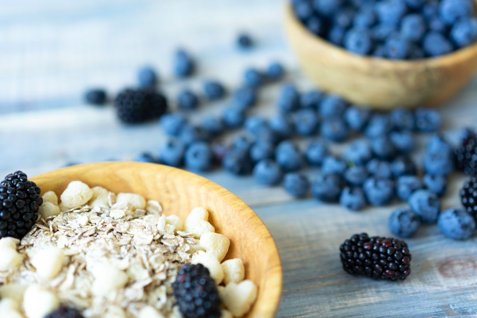 Rolled oats in a bowl with fresh blueberries