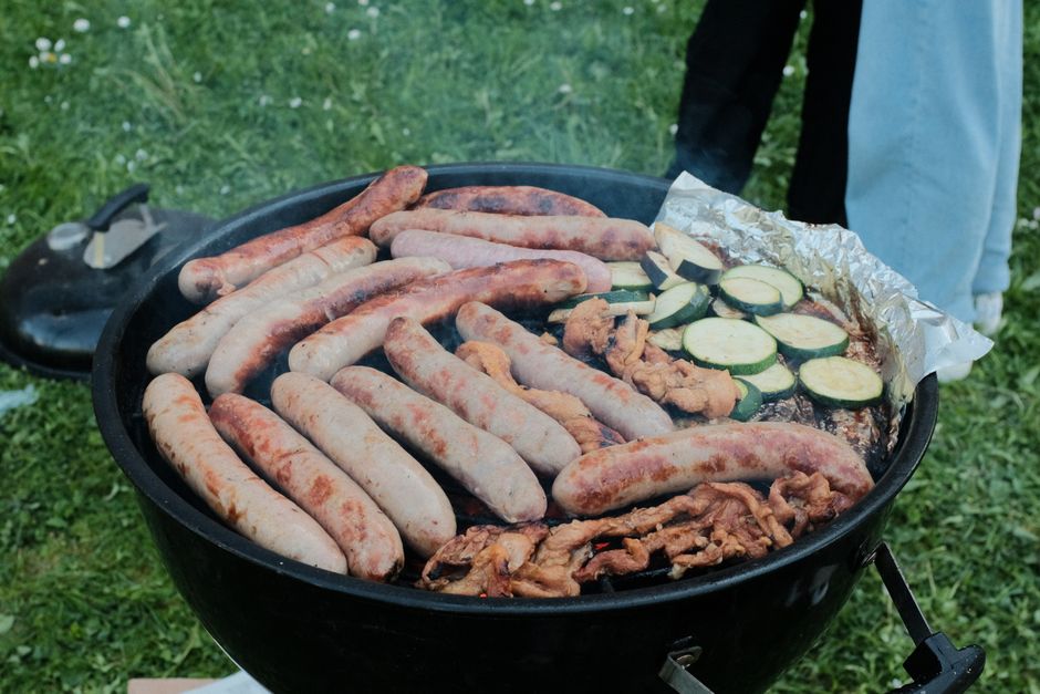 Sausages browning in a pan