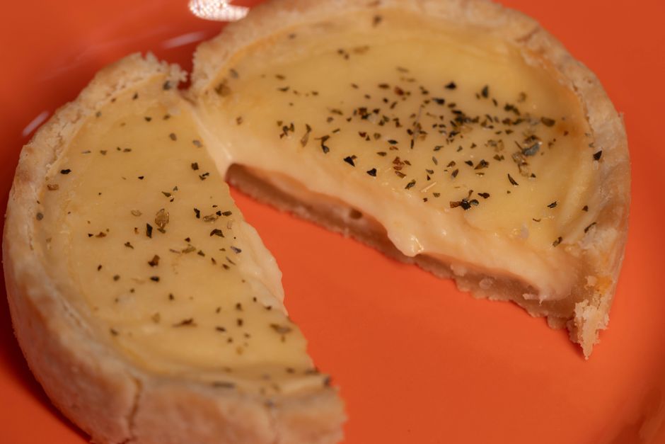 Slice of baked almond tart