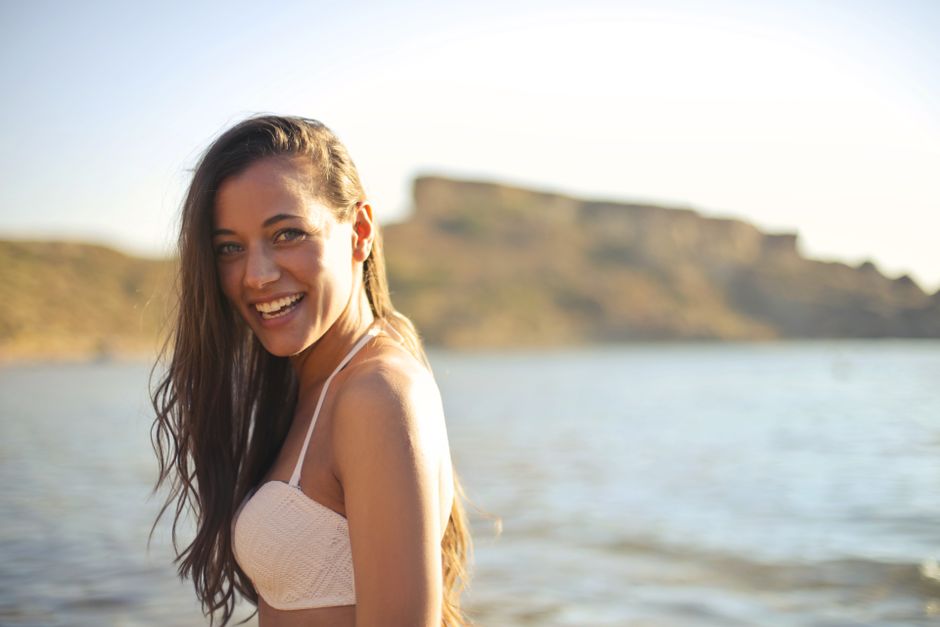 Woman with long hair on a sunny beach